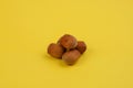 Five nuts on yellow background Royalty Free Stock Photo