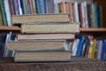Five old books in a library Royalty Free Stock Photo