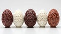 Five ornate chocolate Easter eggs in brown and white Royalty Free Stock Photo