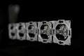 Five outlets in line, disassembled and mounted in black glass wall Royalty Free Stock Photo