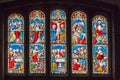 Five panel stained glass window at Caldbeck church in Cumbria