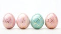 Five pastel eggs with geometric gold patterns, white background, text Royalty Free Stock Photo