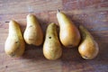 Five pears on a table Royalty Free Stock Photo