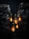 Five pendant tungsten light bulbs on black rocky background. Warm glow of modern lamps with vintage design. Generative AI