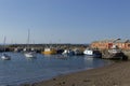 Five People rowing a Boat towards the shoreline within Port Seton Harbour, Royalty Free Stock Photo