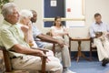 Five people waiting in waiting room Royalty Free Stock Photo