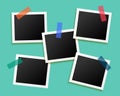 Five photo frames sticked by tape background