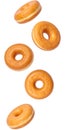Five plain donuts falling down on transparent background Royalty Free Stock Photo