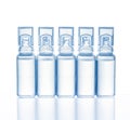 Five plastic medical ampoules with reflection, isolated on a white background Royalty Free Stock Photo