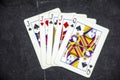 Five playing card`s a hand of a four of a kind jack`s and a queen Royalty Free Stock Photo