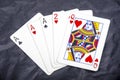 Five playing card`s a hand of a three of a kind ace`s and a two and a queen Royalty Free Stock Photo