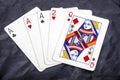 Five playing card`s a hand of a three of a kind ace`s and a two and a queen Royalty Free Stock Photo