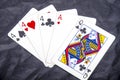 Five playing card`s stud hand three of a kind four and ace a queen fun Royalty Free Stock Photo