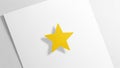 Five pointed star is centrally placed on a plain white sheet Royalty Free Stock Photo