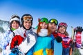 Five positive friends with snowboards Royalty Free Stock Photo