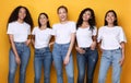 Five Positive Multiethnic Women Posing Standing Together, Yellow Background Royalty Free Stock Photo