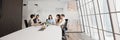 Five professionals engaged in discussion at conference table, panoramic image Royalty Free Stock Photo