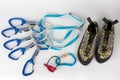 Five quick draws on  sewn loop sling. Upper carabiner with straight gate and lower carabiner with wire gate.  Climbing footwear Royalty Free Stock Photo