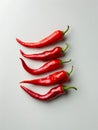 Five red chili peppers on a white background Royalty Free Stock Photo
