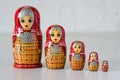 Five red matryoshka. Blurred background