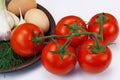 Five red ripe tomatoes and two eggs Royalty Free Stock Photo