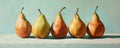 Five ripe pears on a table against a light blue background, still life art concept Royalty Free Stock Photo