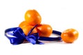 Five ripe sweet mandarins with blue ribbon Royalty Free Stock Photo