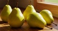 Five Ripe Yellow Pears on Wooden Table in Sunlight Royalty Free Stock Photo