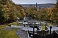 Five Rise Locks in Bingley and yellow trees captured on an autumn day under the gloomy clouds