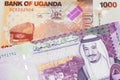 Ugandan currency paired with money from Saudi Arabia