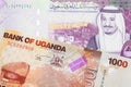 Ugandan currency paired with money from Saudi Arabia