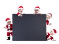 Five Santa Claus baby hold black advertisment banner blank Royalty Free Stock Photo