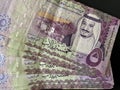 A five Saudi Arabian bill with a fifty pound note from Sudan close up in macro