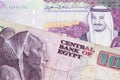 A five Saudi riyal bank note with an Egyptian pound note