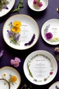 Five sets of white plates on purple background with flower decoration.