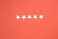 five stars on a coral background