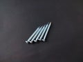 five silver concrete nails 3 cm long Royalty Free Stock Photo