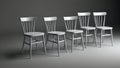Five simple white chairs in a row Royalty Free Stock Photo