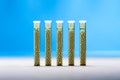 Five small glass tubes with homeopathy globules Royalty Free Stock Photo