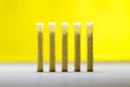 Five small glass tubes with homeopathy globules Royalty Free Stock Photo