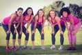 Five smiling runners supporting breast cancer marathon Royalty Free Stock Photo