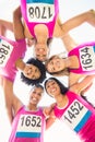 Five smiling runners supporting breast cancer marathon Royalty Free Stock Photo