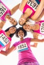 Five smiling runners supporting breast cancer marathon Royalty Free Stock Photo