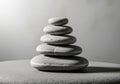 Five smooth, gray pebbles are stacked in a balanced stone arrangement Royalty Free Stock Photo