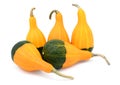 Five smooth, pear-shaped orange and green ornamental gourds