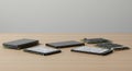 Five solid-state drives (SSDs) laid out on a wooden surface. The SSDs vary in size and Royalty Free Stock Photo