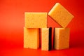 five sponges for cleaning on a red background Royalty Free Stock Photo