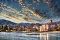 The Five Star Broadmoor Hotel in Colorado Springs with frozen pond, ice, mountains and clouds