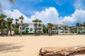 five-star hotel on the shores of Karon Beach with palm trees and yellow creaky sand