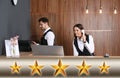 Five Star Luxury Hotel. Receptionists working at desk